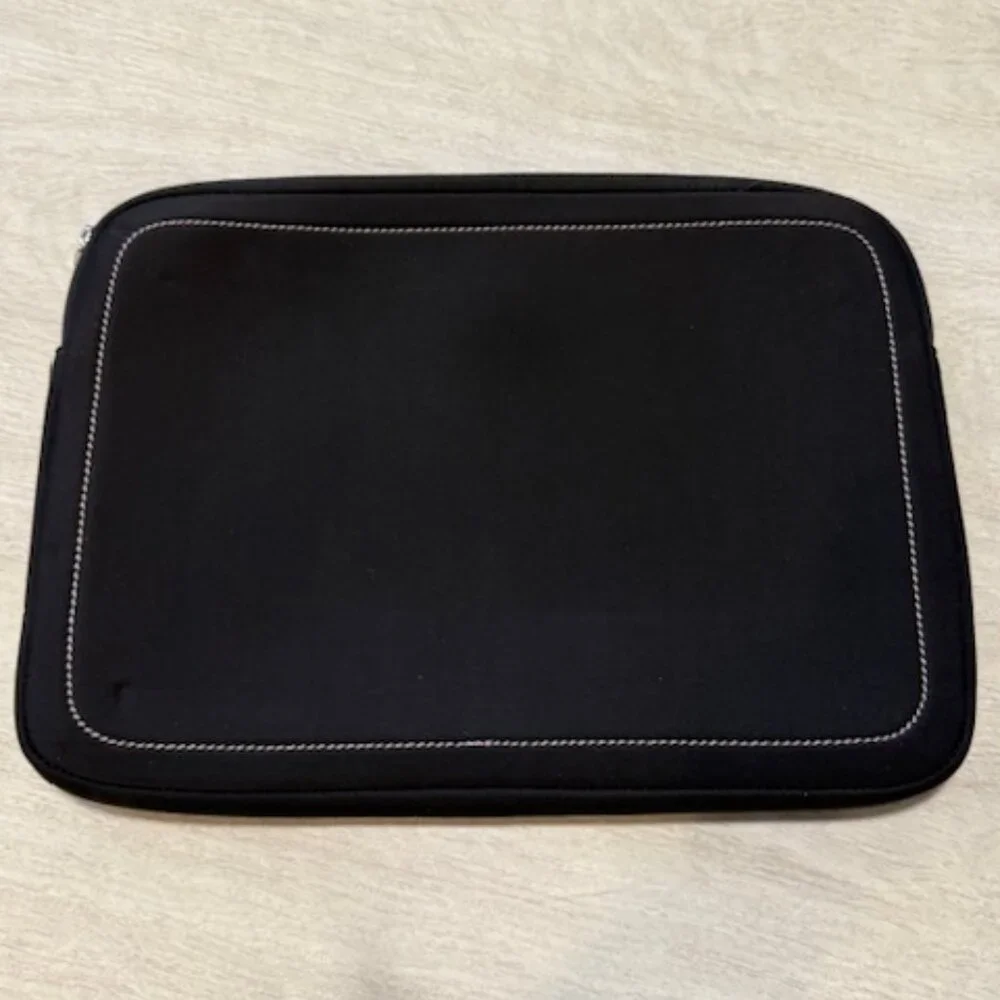 Tumi laptop sleeve.